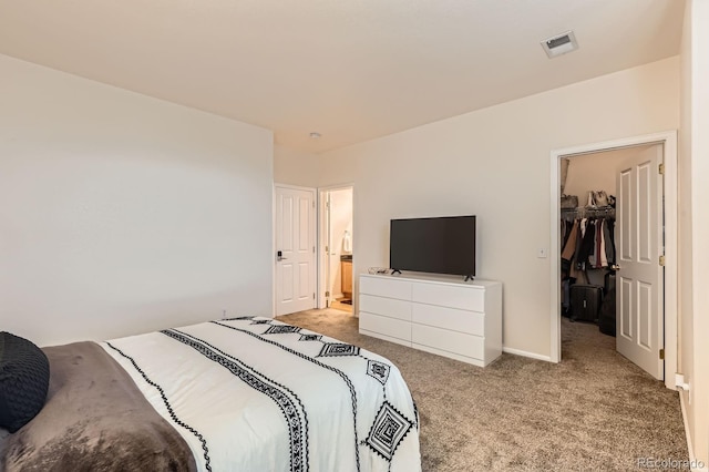 14700 E 104th Ave Unit 2802, Commerce City, CO 80022 - bedroom featuring carpet flooring, a spacious closet, a closet, and ensuite bath