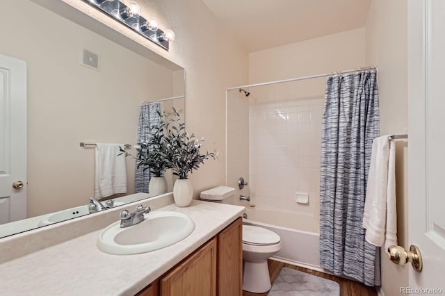 14700 E 104th Ave Unit 2802, Commerce City, CO 80022 - bathroom with wood finished floors, vanity, shower / bathtub combination with curtain, and toilet