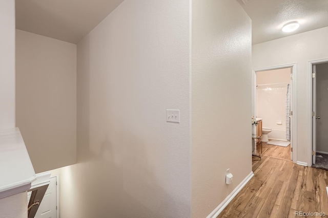 14700 E 104th Ave Unit 2802, Commerce City, CO 80022 - hallway with wood finished floors and baseboards