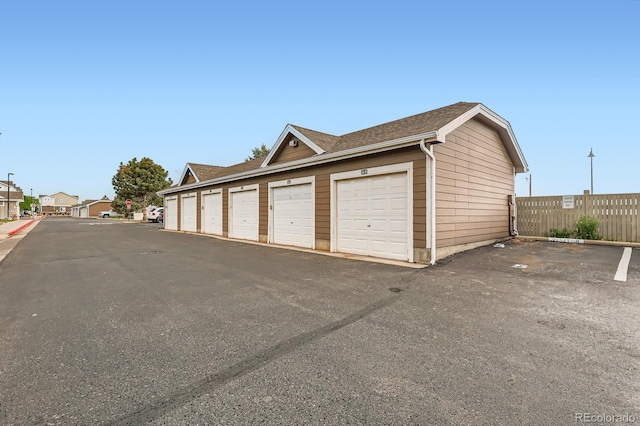 14700 E 104th Ave Unit 2802, Commerce City, CO 80022 - garage with fence