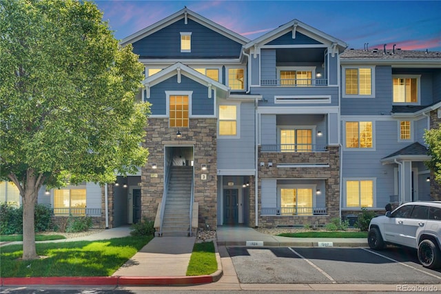 5255 Memphis St Unit 317, Denver, CO 80239 - multi unit property featuring stone siding and uncovered parking