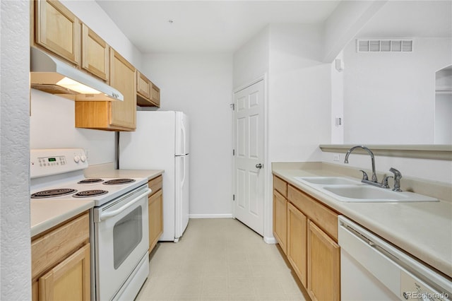 5255 Memphis St Unit 317, Denver, CO 80239 - kitchen featuring white appliances, under cabinet range hood, light countertops, light brown cabinetry, and light flooring