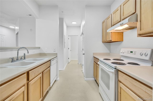 5255 Memphis St Unit 317, Denver, CO 80239 - kitchen with white appliances, under cabinet range hood, light brown cabinets, light countertops, and light floors