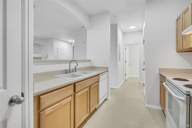 5255 Memphis St Unit 317, Denver, CO 80239 - kitchen with white appliances, arched walkways, light countertops, and light brown cabinetry