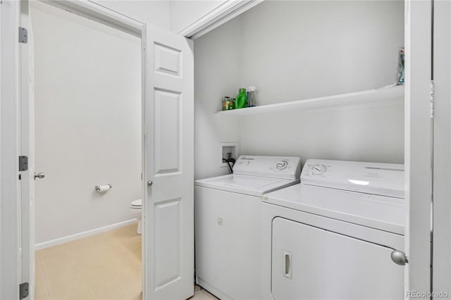 5255 Memphis St Unit 317, Denver, CO 80239 - laundry area with washer and dryer and baseboards