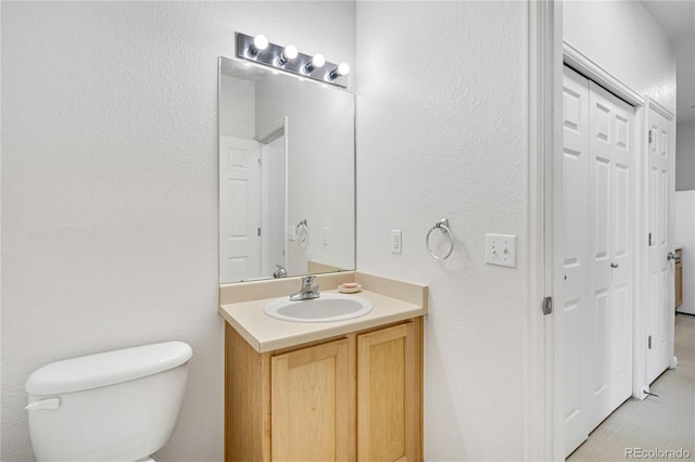 5255 Memphis St Unit 317, Denver, CO 80239 - bathroom with vanity and a textured wall