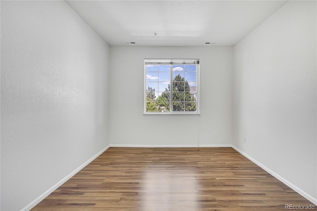 5255 Memphis St Unit 317, Denver, CO 80239 - empty room with wood finished floors