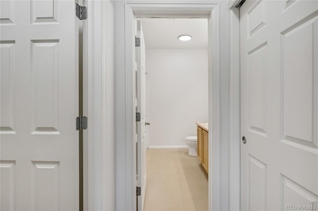 5255 Memphis St Unit 317, Denver, CO 80239 - hall featuring light floors and baseboards