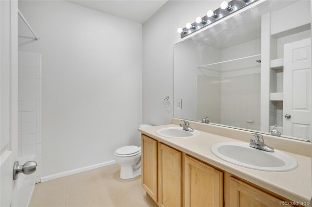 5255 Memphis St Unit 317, Denver, CO 80239 - bathroom featuring a shower and double vanity