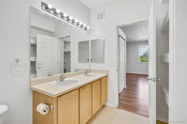 5255 Memphis St Unit 317, Denver, CO 80239 - full bath featuring double vanity and baseboards