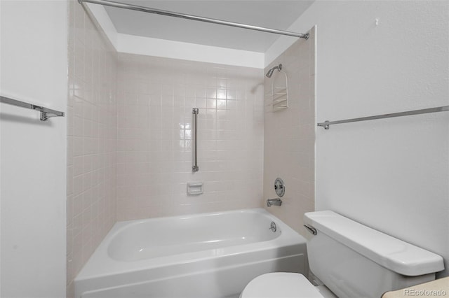 bathroom featuring shower / tub combination and toilet