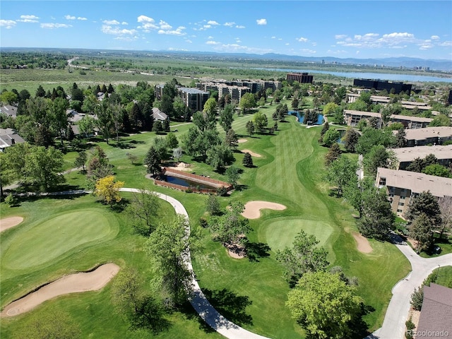drone / aerial view featuring golf course view and a water and mountain view
