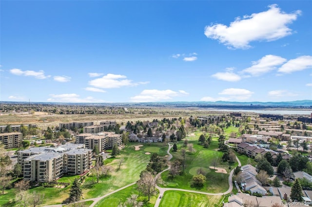 birds eye view of property with golf course view and a water and mountain view