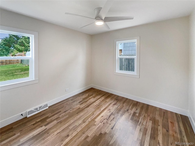 unfurnished room featuring ceiling fan and wood-type flooring