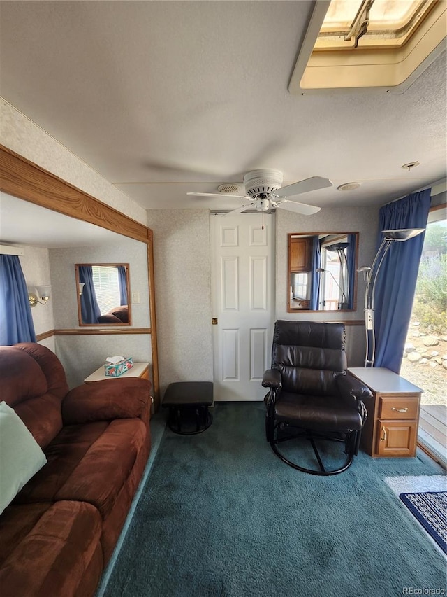 carpeted living room featuring ceiling fan