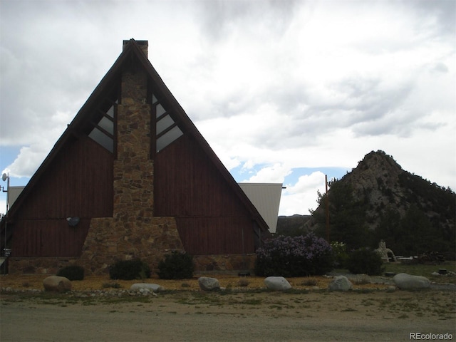 10795 County Road 197a Unit 290, Nathrop, CO 81236 - view of side of property with a barn, an outdoor structure, and a chimney