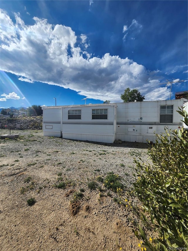 view of property exterior featuring a mountain view