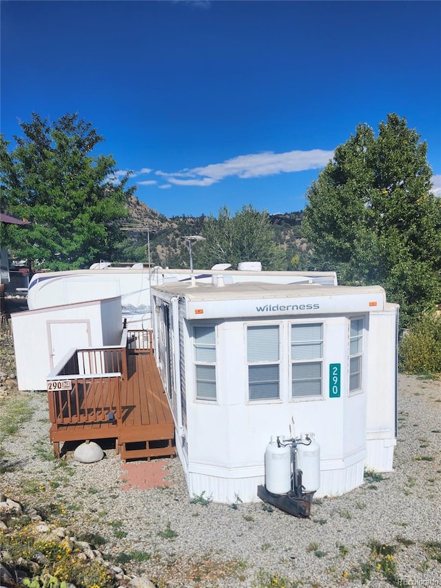 back of house featuring a mountain view