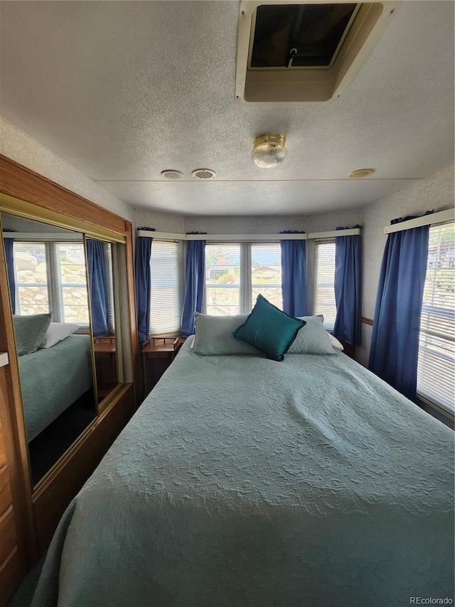 bedroom with a textured ceiling