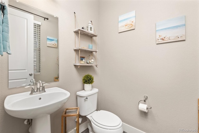 bathroom with sink and toilet