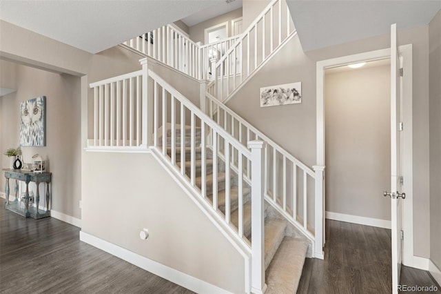 stairs with hardwood / wood-style flooring