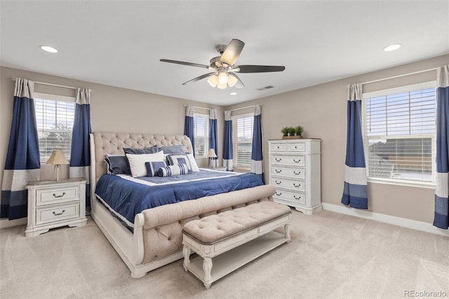 bedroom featuring light carpet and ceiling fan