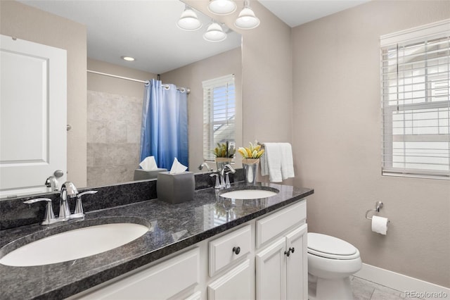 bathroom featuring vanity, tile patterned flooring, a shower with curtain, and toilet