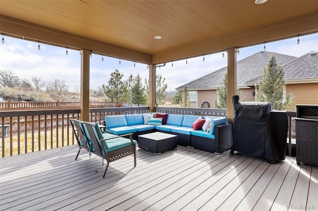 deck featuring outdoor lounge area and area for grilling