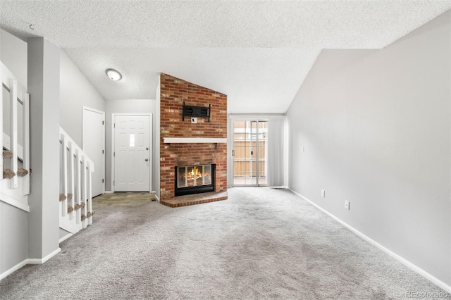 14343 E Dickinson Dr Unit E, Aurora, CO 80014 - unfurnished living room featuring baseboards, a textured ceiling, carpet, and lofted ceiling