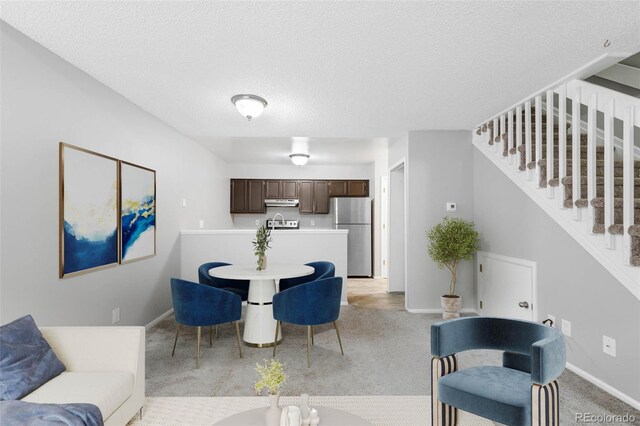14343 E Dickinson Dr Unit E, Aurora, CO 80014 - living area with baseboards and light carpet