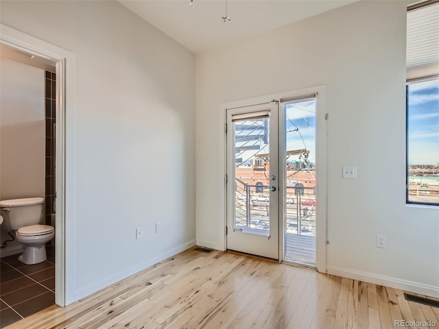 entryway with light hardwood / wood-style floors