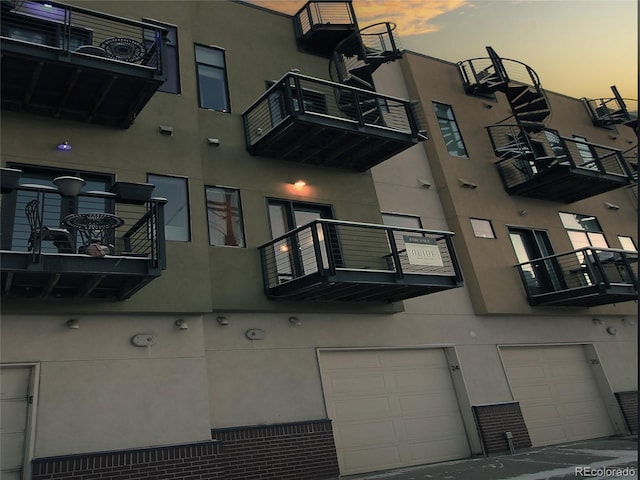 view of outdoor building at dusk