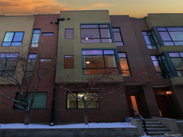 view of outdoor building at dusk