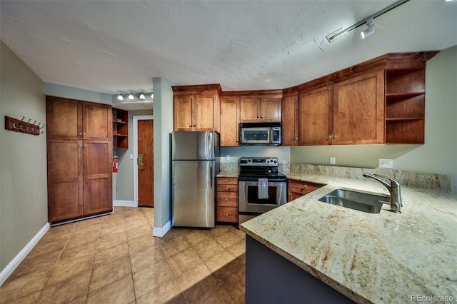 310 Iron Horse Way Unit D5034, Winter Park, CO 80482 - kitchen with appliances with stainless steel finishes, open shelves, and rail lighting