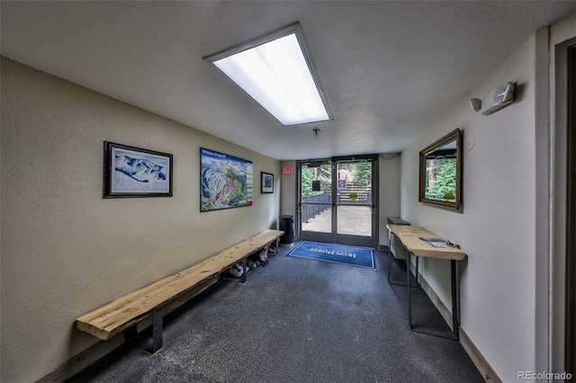 310 Iron Horse Way Unit D5034, Winter Park, CO 80482 - entrance foyer with dark colored carpet and a textured wall