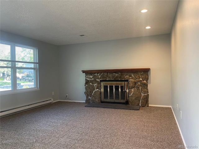 2617 S Cimarron St, Aurora, CO 80014 - unfurnished living room featuring a baseboard heating unit, carpet flooring, a textured ceiling, a fireplace, and recessed lighting