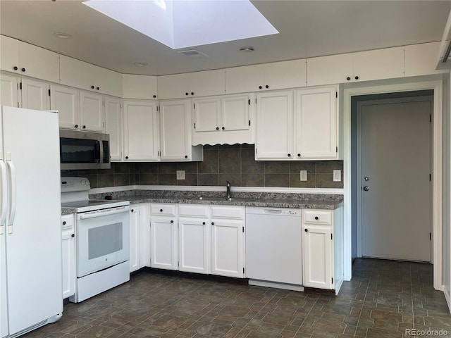 2617 S Cimarron St, Aurora, CO 80014 - kitchen with white appliances, a sink, white cabinetry, and stone finish flooring