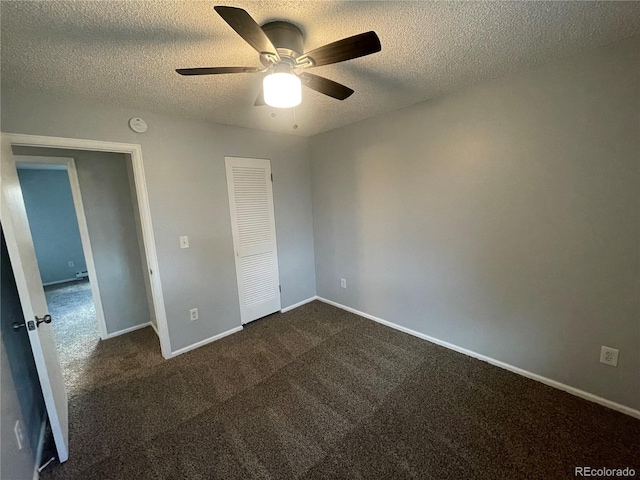 2617 S Cimarron St, Aurora, CO 80014 - unfurnished bedroom with a textured ceiling, dark carpet, a closet, ceiling fan, and baseboards