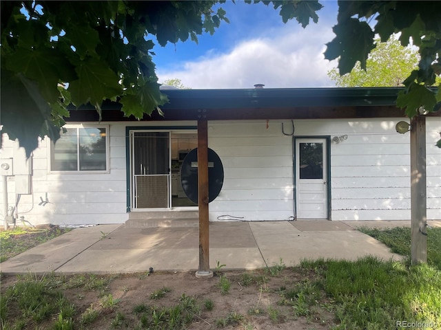 2617 S Cimarron St, Aurora, CO 80014 - back of house featuring a patio