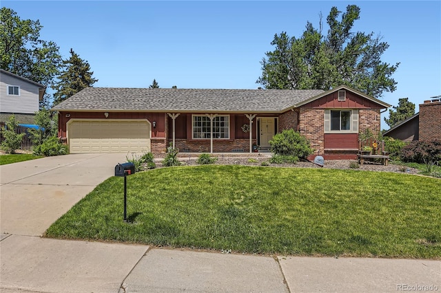 10247 W Arkansas Ave, Lakewood, CO 80232 - single story home featuring an attached garage, a front lawn, concrete driveway, and brick siding