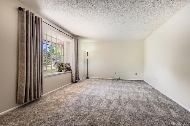 10247 W Arkansas Ave, Lakewood, CO 80232 - carpeted spare room featuring a textured ceiling and baseboards