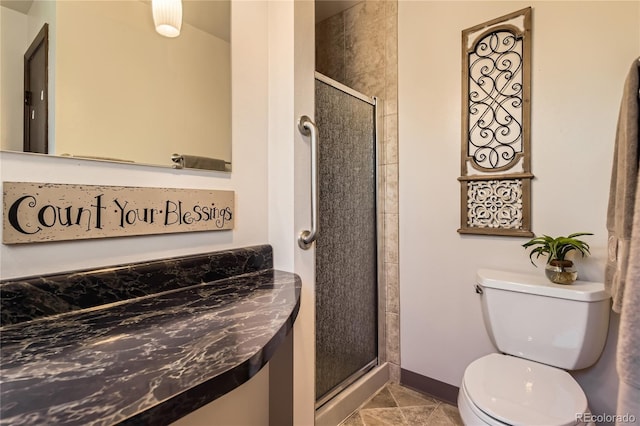 10247 W Arkansas Ave, Lakewood, CO 80232 - bathroom featuring a shower stall, toilet, and baseboards