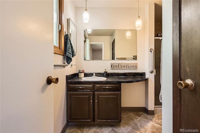 10247 W Arkansas Ave, Lakewood, CO 80232 - bathroom with vanity and baseboards