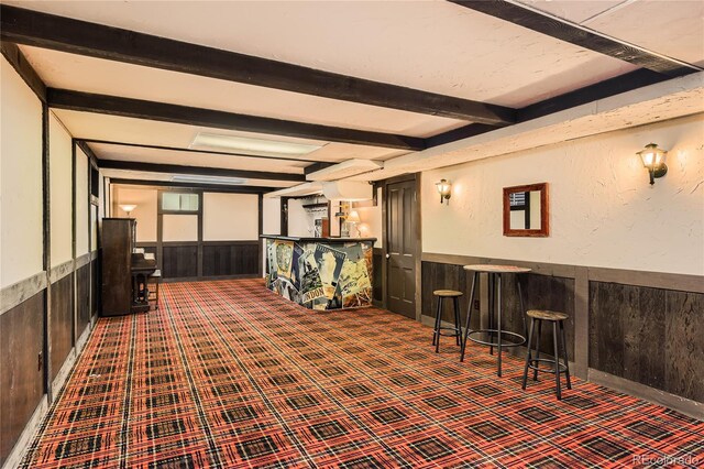 10247 W Arkansas Ave, Lakewood, CO 80232 - interior space with a wainscoted wall, beamed ceiling, carpet floors, and wood walls