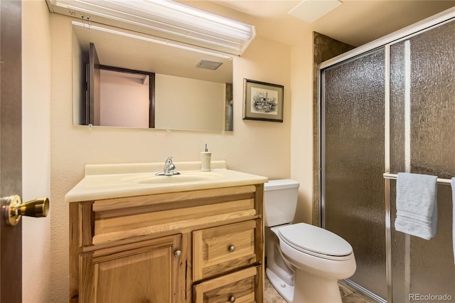 10247 W Arkansas Ave, Lakewood, CO 80232 - full bathroom featuring toilet, a stall shower, and vanity