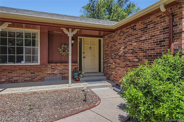 10247 W Arkansas Ave, Lakewood, CO 80232 - property entrance with brick siding