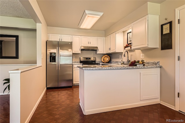 10247 W Arkansas Ave, Lakewood, CO 80232 - kitchen featuring appliances with stainless steel finishes, under cabinet range hood, a peninsula, white cabinets, and baseboards