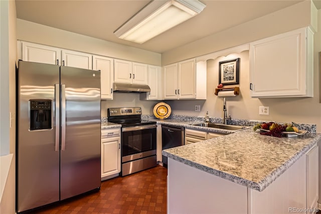 10247 W Arkansas Ave, Lakewood, CO 80232 - kitchen with appliances with stainless steel finishes, under cabinet range hood, white cabinetry, and a peninsula