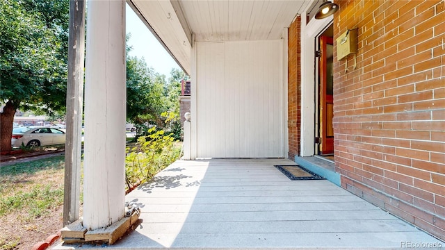 exterior space featuring brick siding