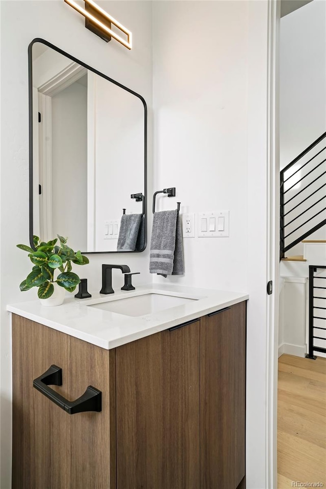 bathroom featuring hardwood / wood-style floors and vanity